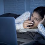 young women in front ol laptop in sleeping time.